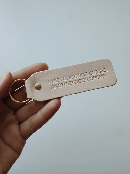 “When One Door Opens, Another Door Closes” Keychain